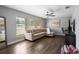 Comfortable living room filled with natural light, ceiling fan, and cozy sectional sofa at 9501 Holbrook Dr, Orlando, FL 32817
