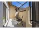 Enclosed patio featuring a small table and two chairs providing an excellent outdoor seating area at 9501 Holbrook Dr, Orlando, FL 32817
