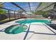 Screen enclosed pool and spa with plenty of patio space for entertaining friends and Gathering at 9501 Holbrook Dr, Orlando, FL 32817