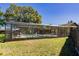 A beautiful backyard features a pool within a screened enclosure, providing privacy and outdoor enjoyment at 9501 Holbrook Dr, Orlando, FL 32817