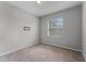 Neutral bedroom featuring carpeted floors and a window at 9899 Leland Dr, Orlando, FL 32827