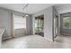 Bright dining area featuring tile flooring, neutral walls, and sliding glass doors to the lanai at 9899 Leland Dr, Orlando, FL 32827