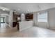 Open kitchen and dining area with tile flooring, dark wood cabinets, and modern stainless steel appliances at 9899 Leland Dr, Orlando, FL 32827