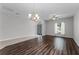 Open living room featuring ceiling fan, hardwood floors, and neutral paint at 9899 Leland Dr, Orlando, FL 32827