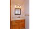 Bathroom featuring a vanity with a mirror and an ornamental three-bulb vanity light at 10020 Creekwater Blvd, Orlando, FL 32825