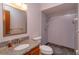 Bathroom with granite countertop, updated vanity, toilet, and a shower with blue tiling at 10020 Creekwater Blvd, Orlando, FL 32825