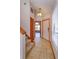 Inviting foyer with tile flooring, staircase, and view into the adjacent living area at 10020 Creekwater Blvd, Orlando, FL 32825