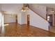 Open-concept living space with laminate floors, a vaulted ceiling, and lots of natural light at 10020 Creekwater Blvd, Orlando, FL 32825