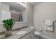 Well-lit bathroom with granite vanity, neutral walls, walk-in shower, and plush towels on a towel bar at 10655 Village Lake Rd, Windermere, FL 34786
