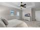 Spacious bedroom with ceiling fan, recessed lighting, and door to the outside at 10655 Village Lake Rd, Windermere, FL 34786