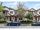 Inviting townhouse exteriors featuring balconies and lush landscaping, perfect for modern living at 10655 Village Lake Rd, Windermere, FL 34786