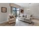 Cozy living room with a view to the outdoor area at 10655 Village Lake Rd, Windermere, FL 34786