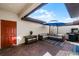 Outdoor patio with an umbrella, comfortable seating, and a grill at 10655 Village Lake Rd, Windermere, FL 34786