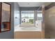 The primary bathroom features a soaking tub, a glass-enclosed shower, and a large window with neighborhood views at 110 Wekiva Pointe Cir, Apopka, FL 32712