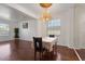 Elegant dining area bathed in natural light with gleaming hardwood floors at 110 Wekiva Pointe Cir, Apopka, FL 32712