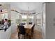 A breakfast nook is well-lit by a large bay window and features a hanging light fixture above the table at 110 Wekiva Pointe Cir, Apopka, FL 32712