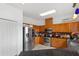 Kitchen featuring stainless steel appliances, granite countertops, and wood cabinetry at 110 Wekiva Pointe Cir, Apopka, FL 32712