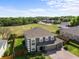 Beautiful home showcasing a spacious backyard with lush greenery and mature trees at 110 Wekiva Pointe Cir, Apopka, FL 32712