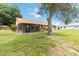 A house with a spacious backyard and a nice screened-in back porch at 1148 Monroe Ave, St Cloud, FL 34769