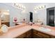 Bathroom featuring dual sinks, lots of counter space and a vanity mirror at 1148 Monroe Ave, St Cloud, FL 34769