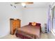 Bedroom with a large window, allowing lots of light, and a ceiling fan at 1148 Monroe Ave, St Cloud, FL 34769