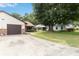 Attractive home showcasing a manicured lawn, a driveway, and an attached two-car garage at 1148 Monroe Ave, St Cloud, FL 34769