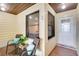 Cozy covered front porch with comfortable seating, creating a relaxing outdoor entryway at 1148 Monroe Ave, St Cloud, FL 34769