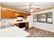 Traditional kitchen with light wood cabinets, white countertops, and a window with natural light at 1148 Monroe Ave, St Cloud, FL 34769