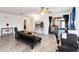 Bright living room showcasing wood laminate floors, sliding glass doors, and an inviting open layout at 1148 Monroe Ave, St Cloud, FL 34769