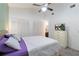 Bright main bedroom featuring a ceiling fan, large closet, and a TV on the dresser at 1148 Monroe Ave, St Cloud, FL 34769