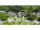 An aerial view showcases this beautiful neighborhood home in a lush, wooded community at 116 Cherry Creek Cir, Winter Springs, FL 32708