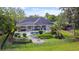 Beautiful backyard with a pool, patio, outdoor kitchen, and beautifully landscaped garden at 116 Cherry Creek Cir, Winter Springs, FL 32708