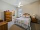 Cozy bedroom features a ceiling fan, nice furniture, and natural light at 116 Cherry Creek Cir, Winter Springs, FL 32708