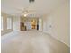 Large bonus room with plush carpet, ceiling fan, and access to additional areas at 116 Cherry Creek Cir, Winter Springs, FL 32708