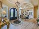 Grand foyer featuring a decorative chandelier, beautiful floors, and an adjacent dining room at 116 Cherry Creek Cir, Winter Springs, FL 32708