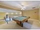 Spacious game room featuring a pool table and ornate metal railing overlooking the lower level at 116 Cherry Creek Cir, Winter Springs, FL 32708