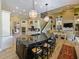 Gourmet kitchen featuring a large island, stainless appliances, and an open layout at 116 Cherry Creek Cir, Winter Springs, FL 32708