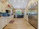 Spacious kitchen featuring stainless appliances, a central island, and custom cabinetry at 116 Cherry Creek Cir, Winter Springs, FL 32708