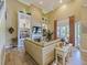 Bright living room with a soaring ceiling, built-in bookshelves, fireplace, and a comfortable beige sectional sofa at 116 Cherry Creek Cir, Winter Springs, FL 32708