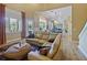 An open-concept living room overlooking the dining and kitchen, hardwood flooring, and plenty of natural light at 116 Cherry Creek Cir, Winter Springs, FL 32708