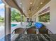 The outdoor living area features a fireplace, TV and comfortable seating at 116 Cherry Creek Cir, Winter Springs, FL 32708