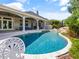 Sparkling pool with rock waterfall feature and covered lanai, perfect for outdoor living at 116 Cherry Creek Cir, Winter Springs, FL 32708