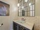 Stylish powder room with unique lighting and fixtures and a glass vessel sink at 116 Cherry Creek Cir, Winter Springs, FL 32708
