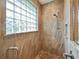 Shower with glass block window and tile walls at 116 Cherry Creek Cir, Winter Springs, FL 32708