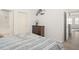 Comfortable bedroom with neutral tones, a dresser, and an ensuite bathroom at 12016 Villanova Dr # 101, Orlando, FL 32837