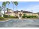 Exterior shot of the clubhouse featuring covered entry and palm trees at 12016 Villanova Dr # 101, Orlando, FL 32837