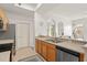 Kitchen with appliances, sink, and an arched entryway to the living room at 12016 Villanova Dr # 101, Orlando, FL 32837