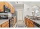 Well-equipped kitchen with stainless steel appliances and ample countertop space at 12016 Villanova Dr # 101, Orlando, FL 32837