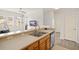 Bright kitchen with a breakfast bar, stainless steel sink, and modern appliances at 12016 Villanova Dr # 101, Orlando, FL 32837