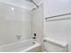 Clean, tiled bathroom featuring a shower and bathtub combination at 1236 Villa Ln # 143, Apopka, FL 32712